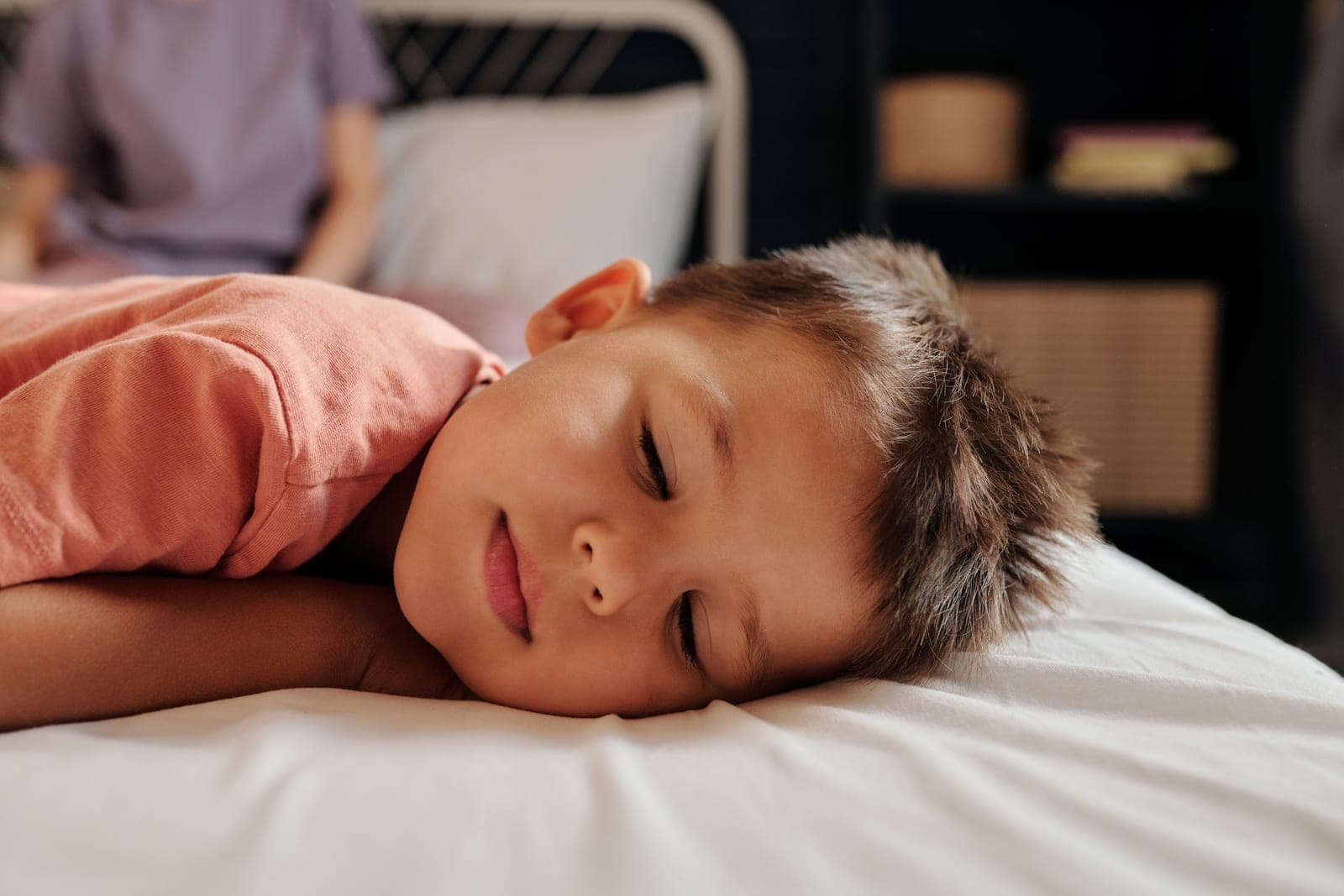 A preschooler asleep on a pillow at rest time